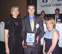 Raymond Connolly accepts his Pacesetter Award from ICCTA Awards Committee members Dr Clare Ollayos (left) and Mary Nolan.