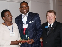 Dr. Gregory James (center) of Oakton Community College accepts ICCTA's 2010 Equity Award from ICCTA Equity Committee chair Phyllis Folarin and ICCTA vice president David Harby.