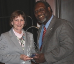 Waubonsee Community College president Dr. Christine Sobek accepts ICCTA's 2012 Equity Award from ICCTA vice president Reggie Coleman.