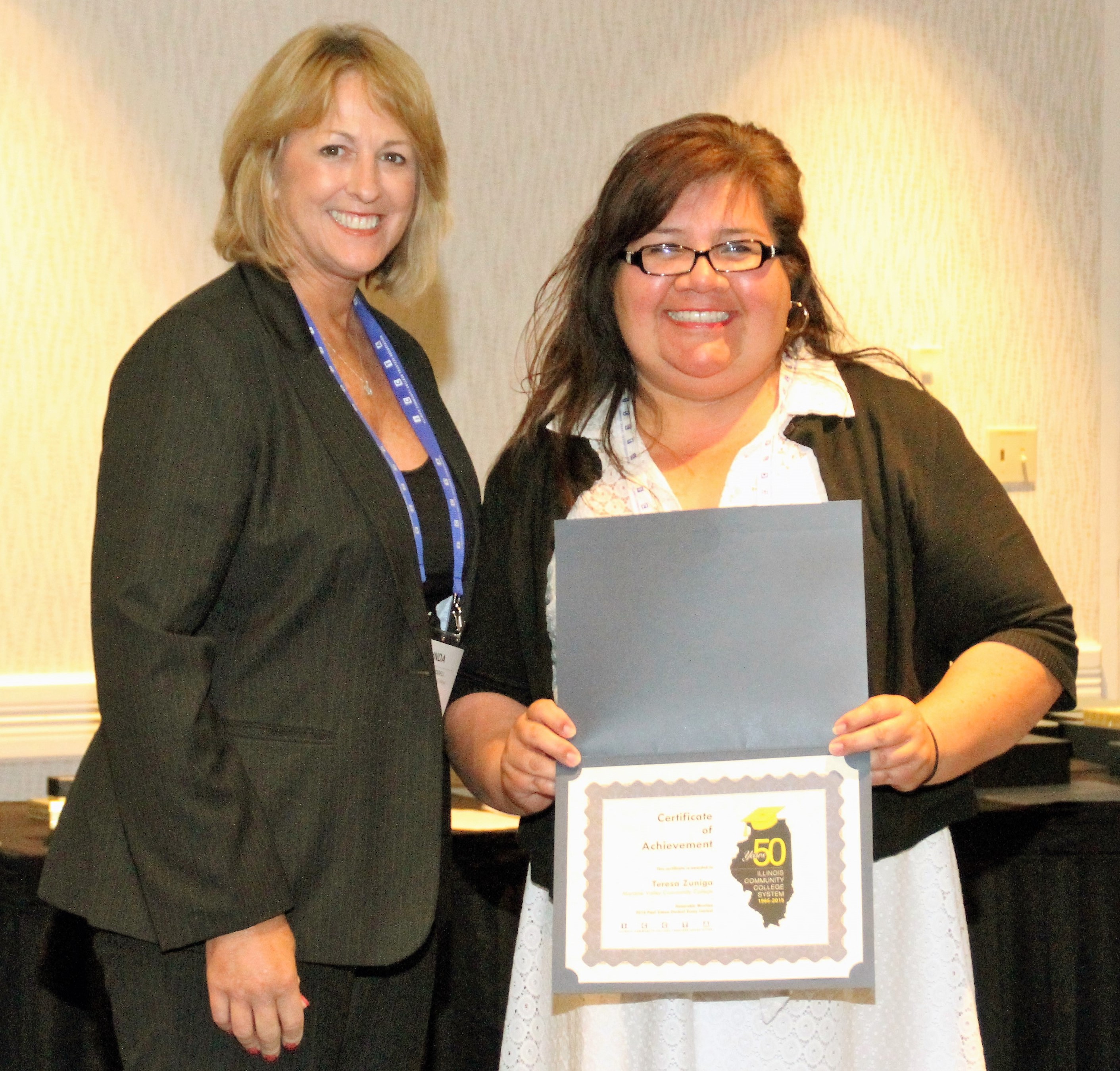 Moraine Valley Community College student Teresa Zuniga accepts her $250 Paul Simon Student Essay Contest scholarshipfrom ICCTA vice president Linda Liddell.