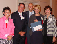 Prairie State College student Peggy Michel (fourth from left)accepts her $500 scholarship from Illinois Senate Majority Leader Debbie Halvorson, Illinois Community College System Foundation board member Richard Wilson, PSC president Paul McCarthy, and PSC trustee Peg Donahue.