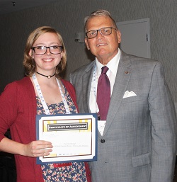 Kaskaskia College student Lauren Stengel accepts her $250 Paul Simon Student Essay Contest scholarshipfrom Illinois Community College System Foundation president Dr. Joe Kanosky.