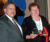 Evelyn McKenna accepts ICCTA's 2007 Lifelong Learning Award from Moraine Valley Community College president Vernon Crawley.