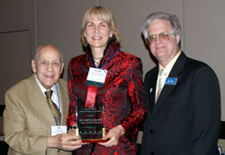 Elgin Community College trustee Dr. Clare Ollayos (middle)receives ICCTA's 2009 Ray Hartstein Trustee Achievement Award from ICCTA Honorary Member Ray Hartstein (left)and ICCTA president Jeff May.