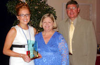 Anna Kesler (left) accepts ICCTA's 2008 Pacesetter Award from ICCTA president Kathy Wessel and Illinois Community College Board chair Guy Alongi.
