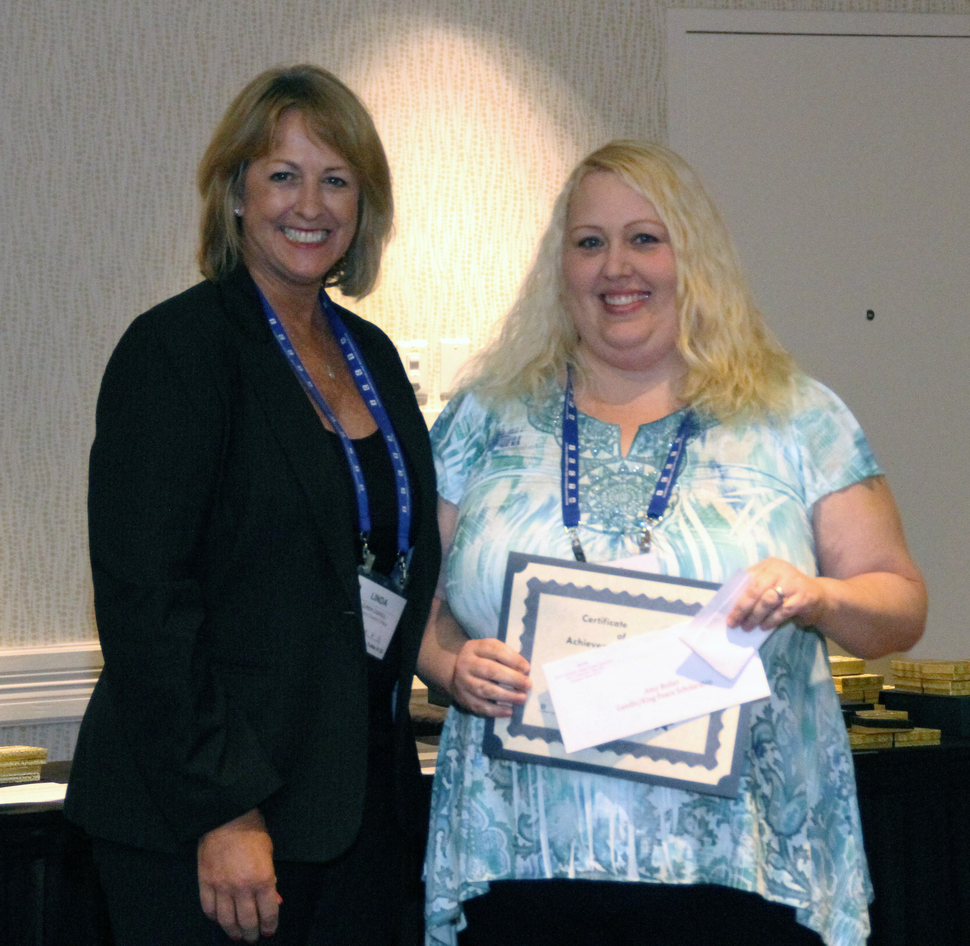 John A. Logan College student Amy Butler accepts her $500 Gandhi/King Peace Essay Scholarshipfrom ICCTA vice president Linda Liddell.