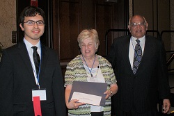 Elgin Community College student Mauro Rosiles (left) accepts his $500 Gandhi/King Peace Essay Scholarshipfrom ICCTA secretary Kathy Spears and Oakton Community College trustee emeritus Jody Wadhwa.