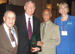 City Colleges of Chicago board chair James Tyree (second from left) receives ICCTA's 2007 Ray Hartstein Trustee Achievement Award from ICCTA Honorary Member Ray Hartstein, City Colleges chancellor Wayne Watson, and ICCTA past president Clare Ollayos.